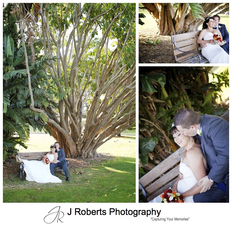 Couple kissing under the trees of the royal botanic gardens sydney - sydney wedding photography 
